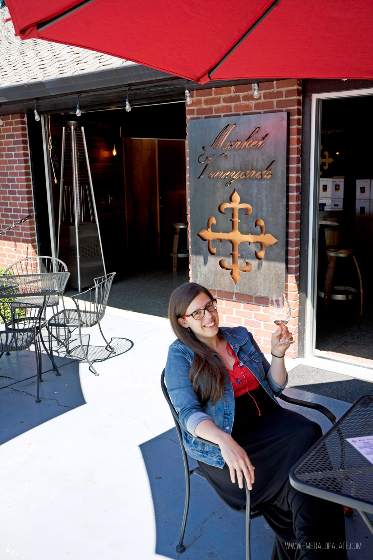 woman enjoying a wine tasting at Market Vineyards in Woodinville