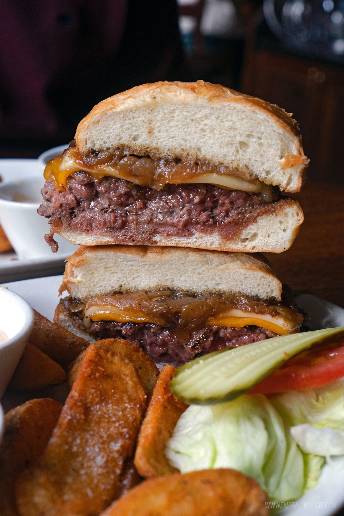 juicy burger in Seattle cut in half and stacked on top of each other