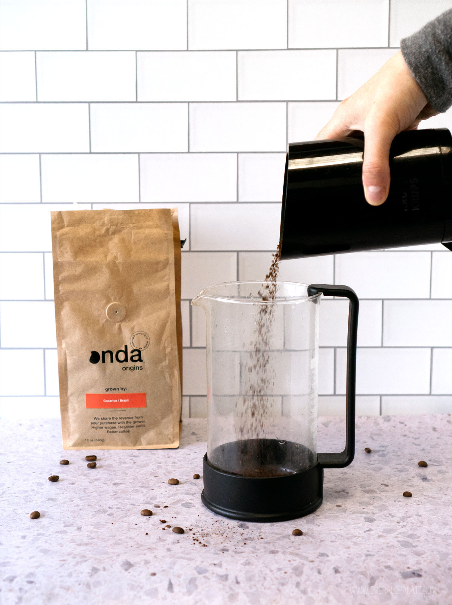 https://www.emeraldpalate.com/wp-content/uploads/2021/04/Best-Coffee-for-French-Press-pouring-grinds-lowres.jpg