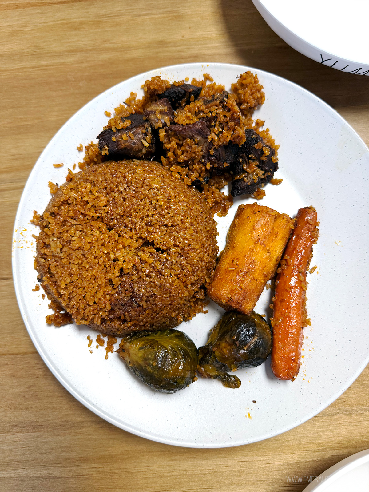 plate of jollof rice with lamb from a Black-owned restaurant in Seattle