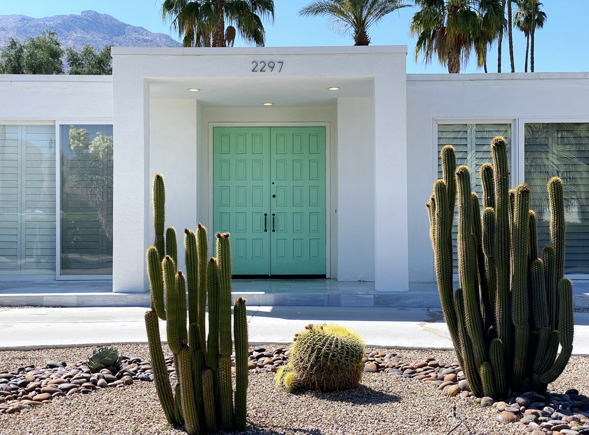 retro mid century modern home with a bright door in Palm Springs, one of the best places to visit on the west coast