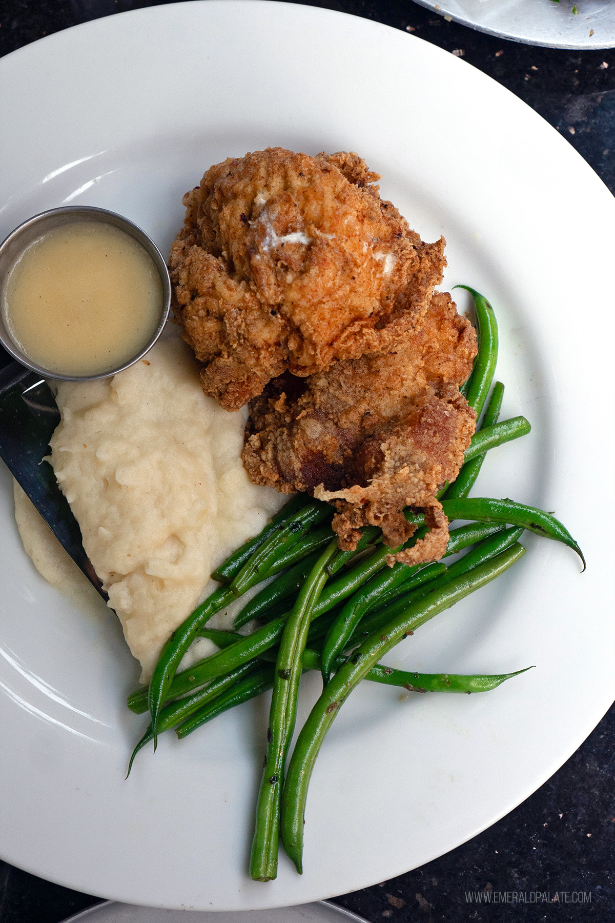 plate of fried chicken, mashed potatoes, and green beans