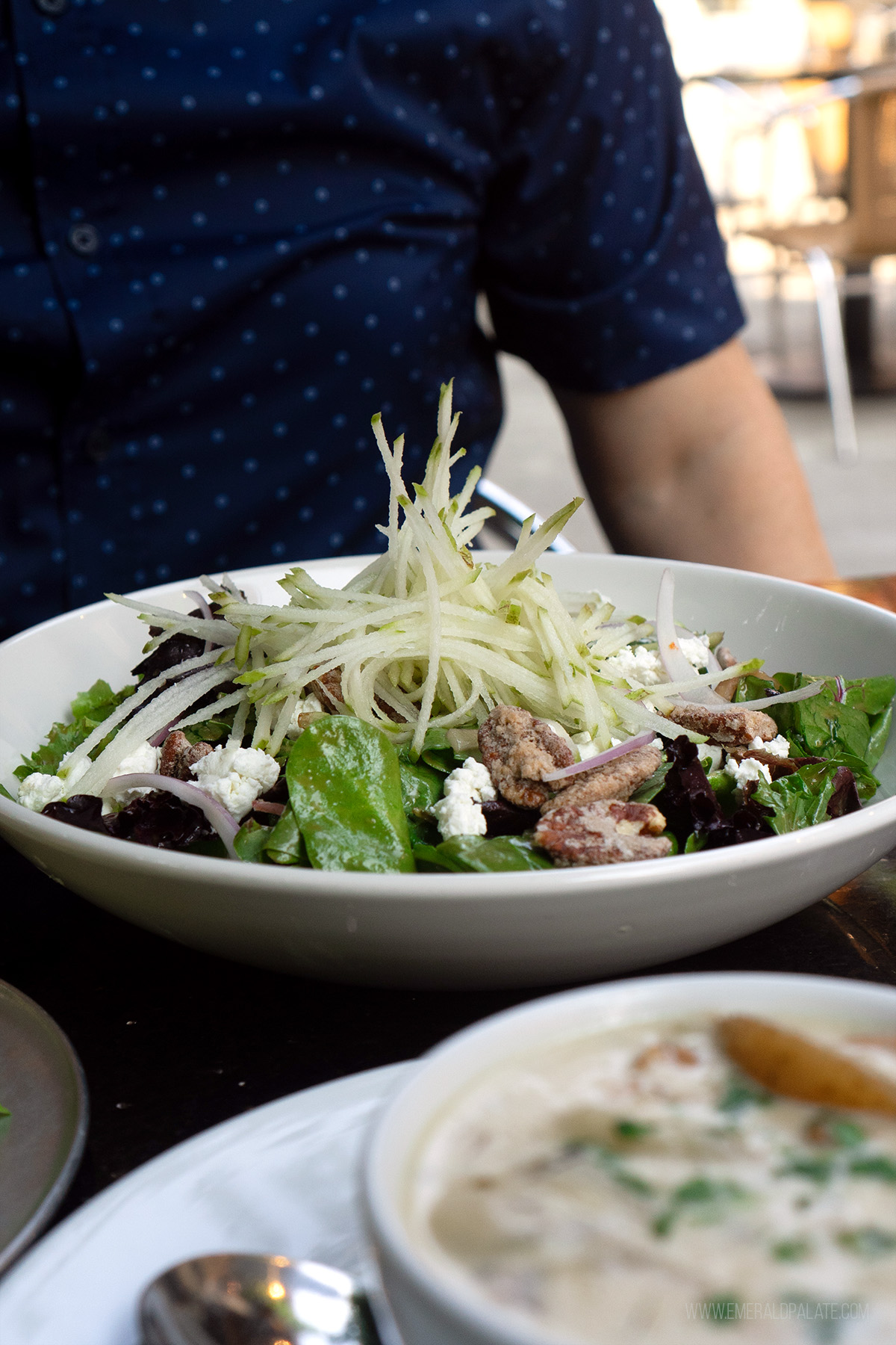 salad with sliced pears piled high from a lunch spot in Seattle