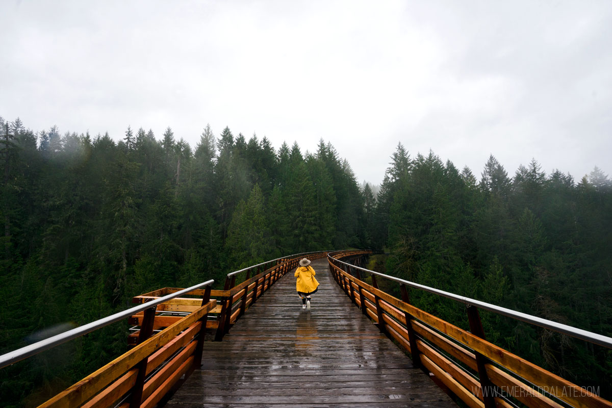 woman running along the Kinsol Trestle, one of the best things to do in Cowichan Valley