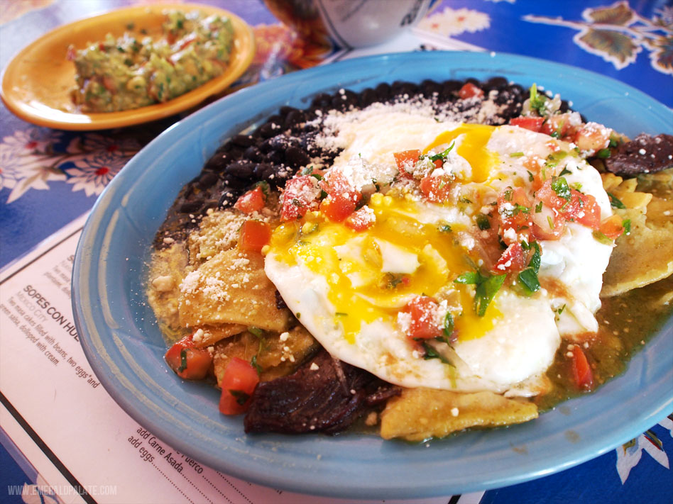 plate of chilaquiles with carne asada from one of the best Mexican restaurants in Seattle