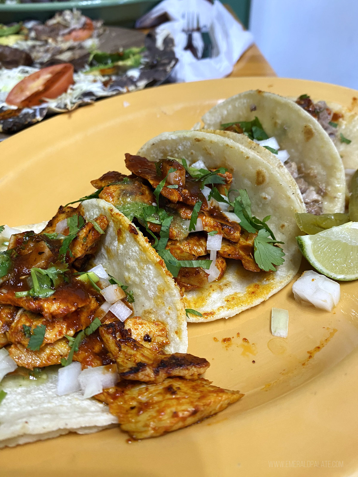 3 tacos on a plate from a Mexican spot in Seattle