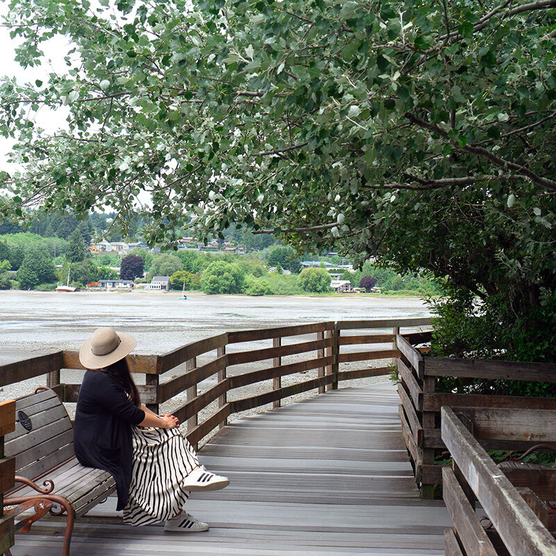 woman on waterfront boardwalk, one of the best things to do in Poulsbo