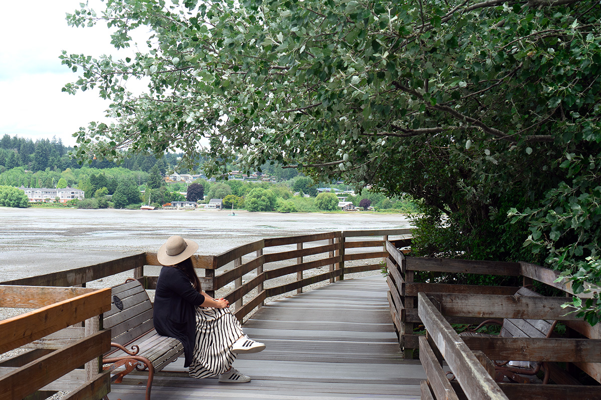 woman on waterfront boardwalk, one of the best things to do in Poulsbo