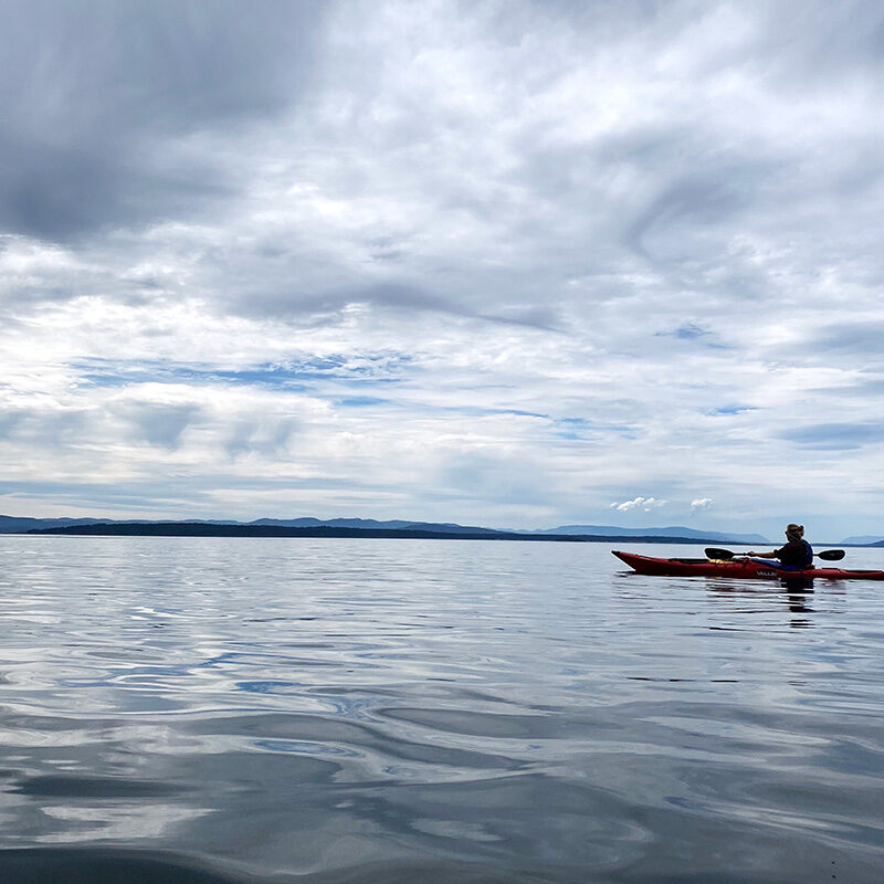 woman kayaking, one of the best Seattle water activities