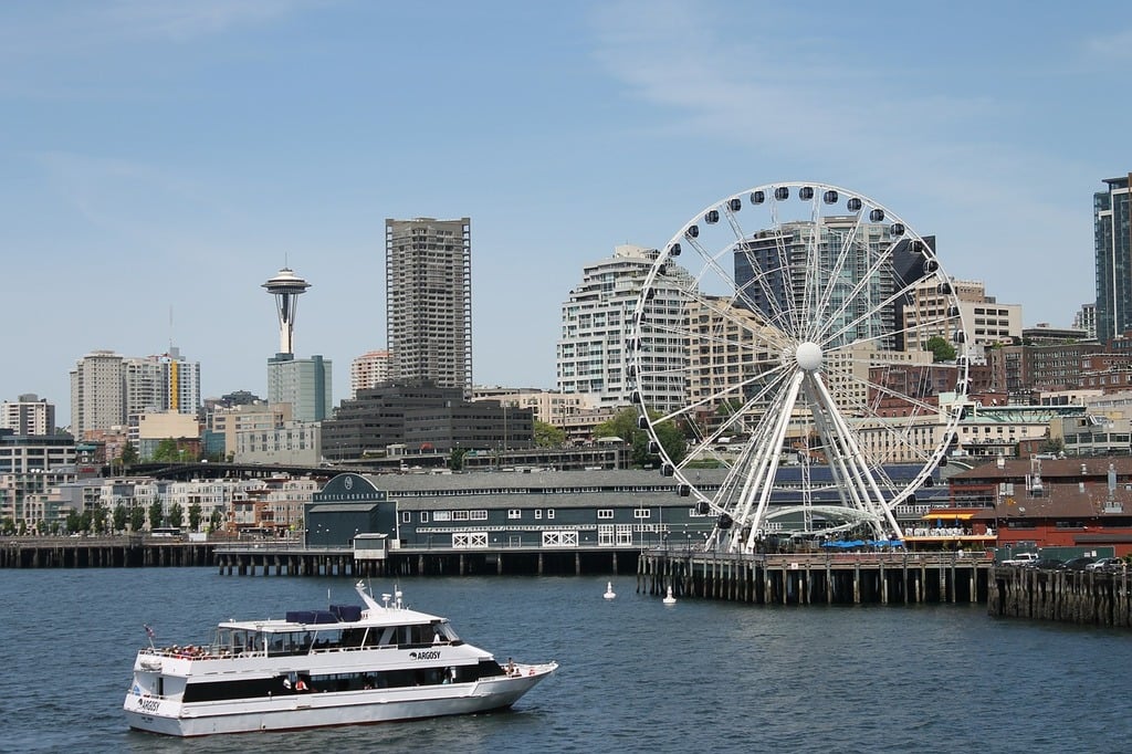 boat cruise in front of the Seattle city skyline