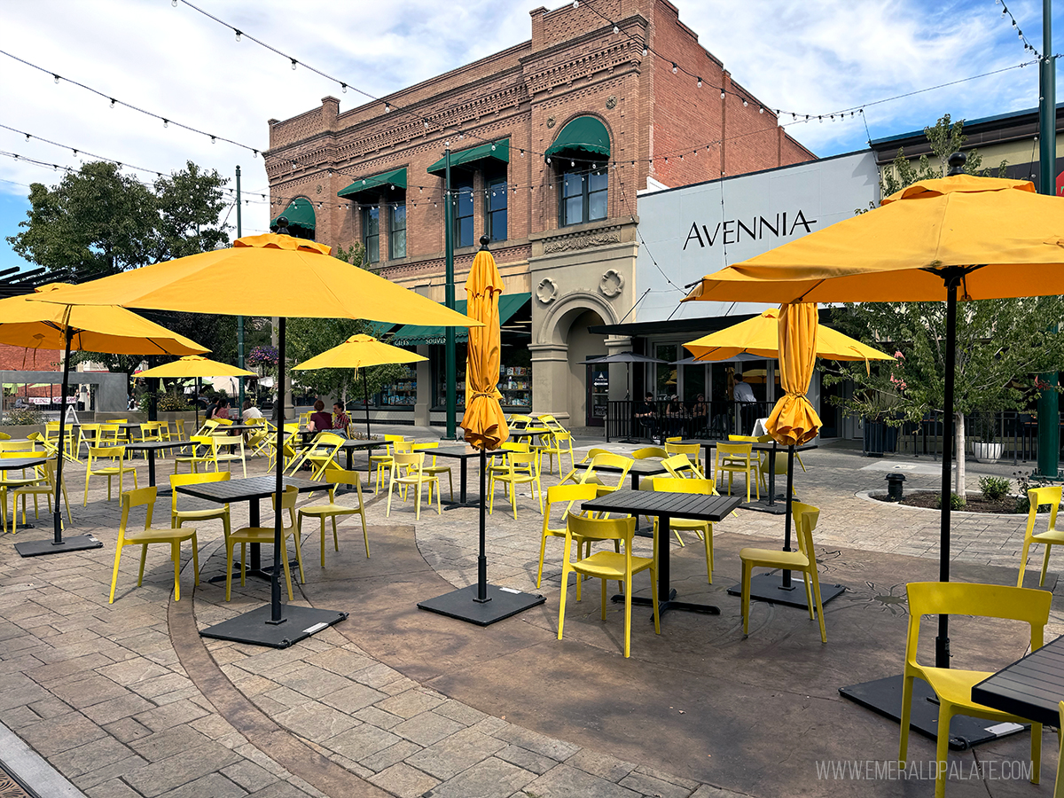 picnic tables and umbrellas in a courtyard