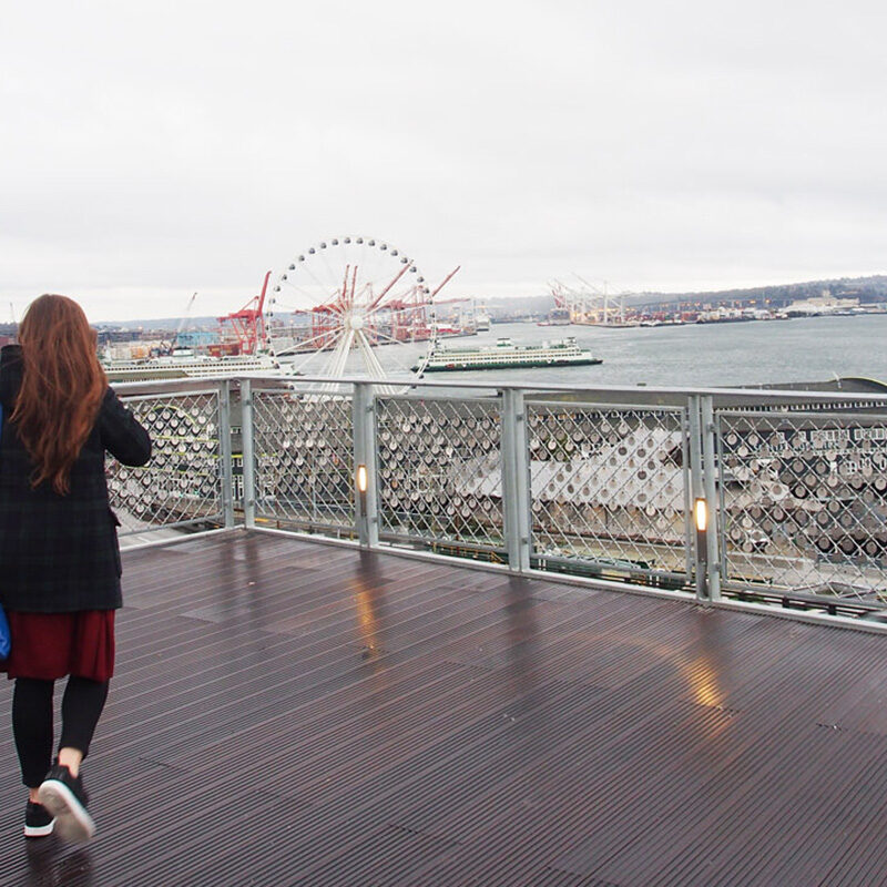 woman exploring Pike Place Market, one of the best things to do in Seattle in January