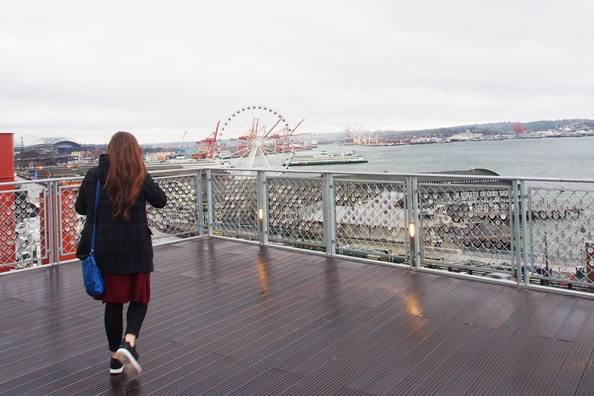 woman exploring Pike Place Market, one of the best things to do in Seattle in January