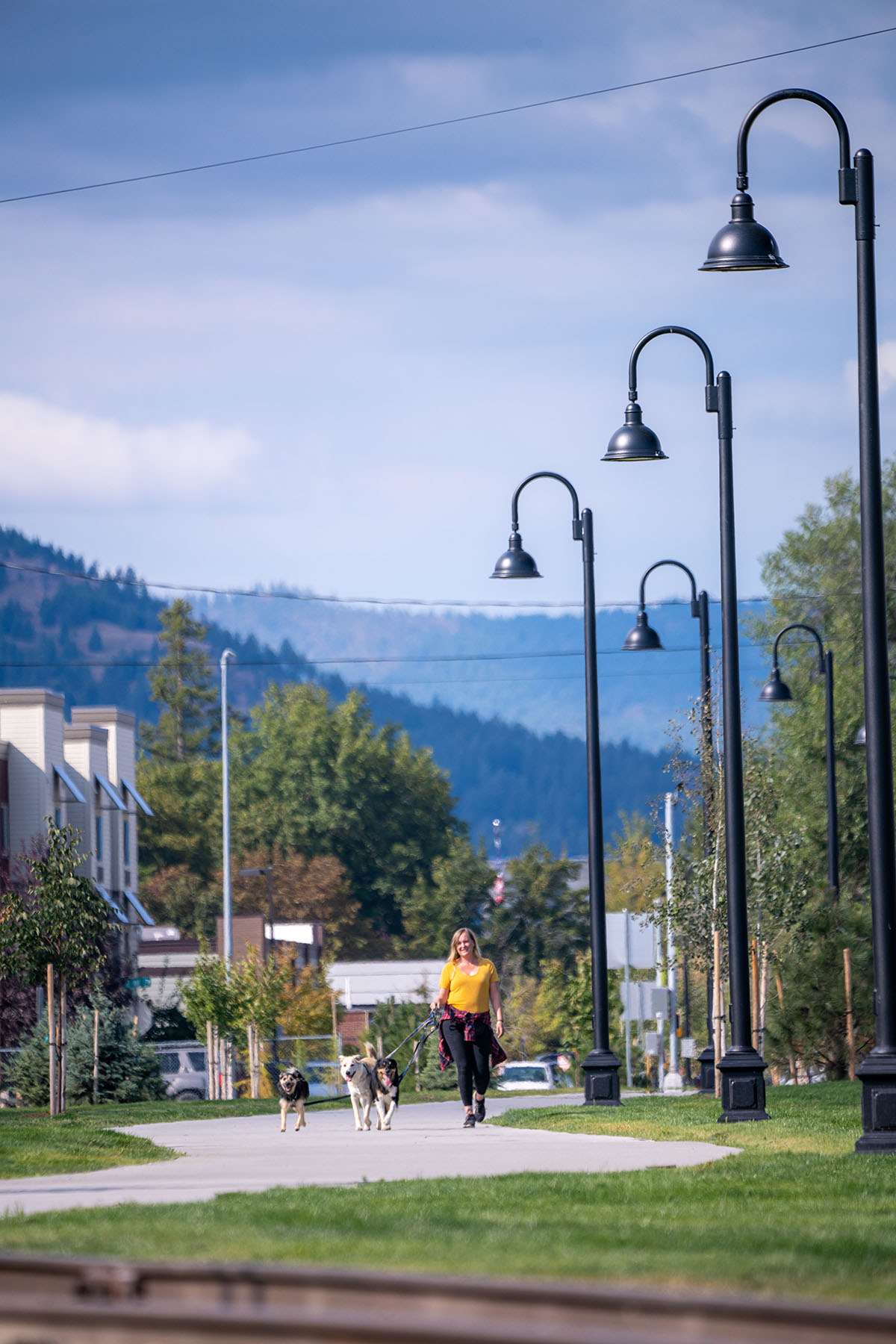 Woman walking along the Parkline Trail in downtown Kalispell