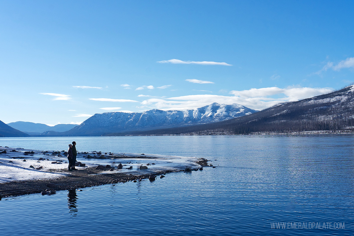 people enjoying views from Lake McDonald, one of the best things to do near Kalispell Montana