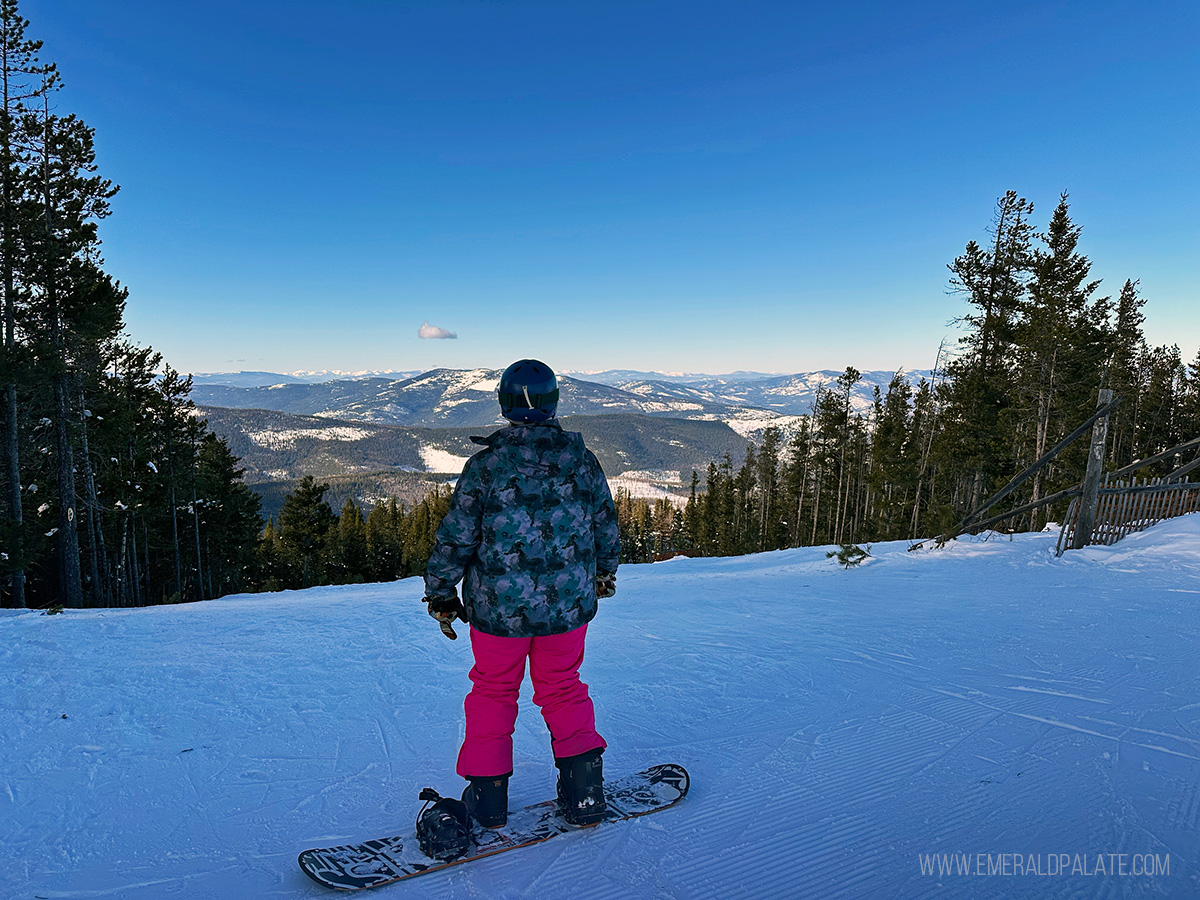 snowboarder taking in the views at Blacktail Mountain