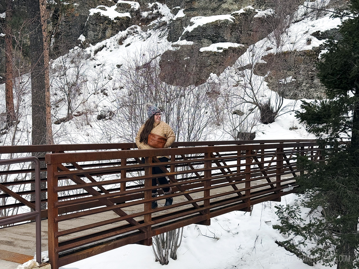 woman walking along a bridge in Lone State Park